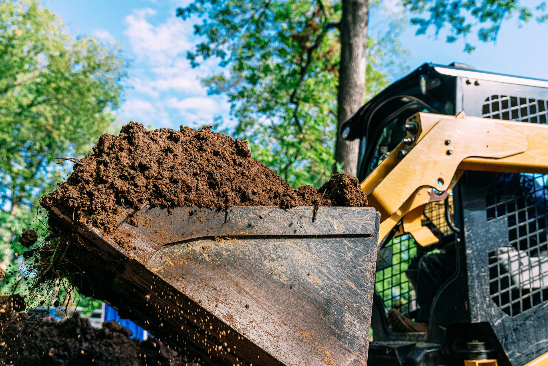 Bulldozer lifting a Large Scoop of Dirt