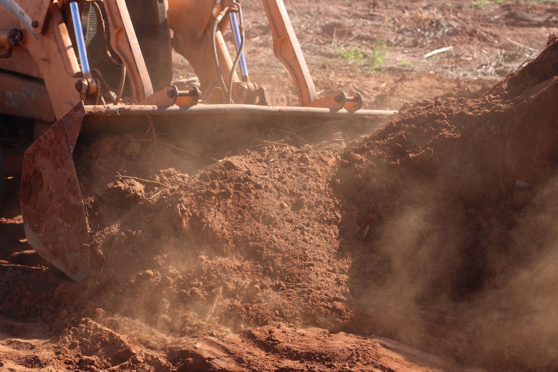 man operating a backhoe machine